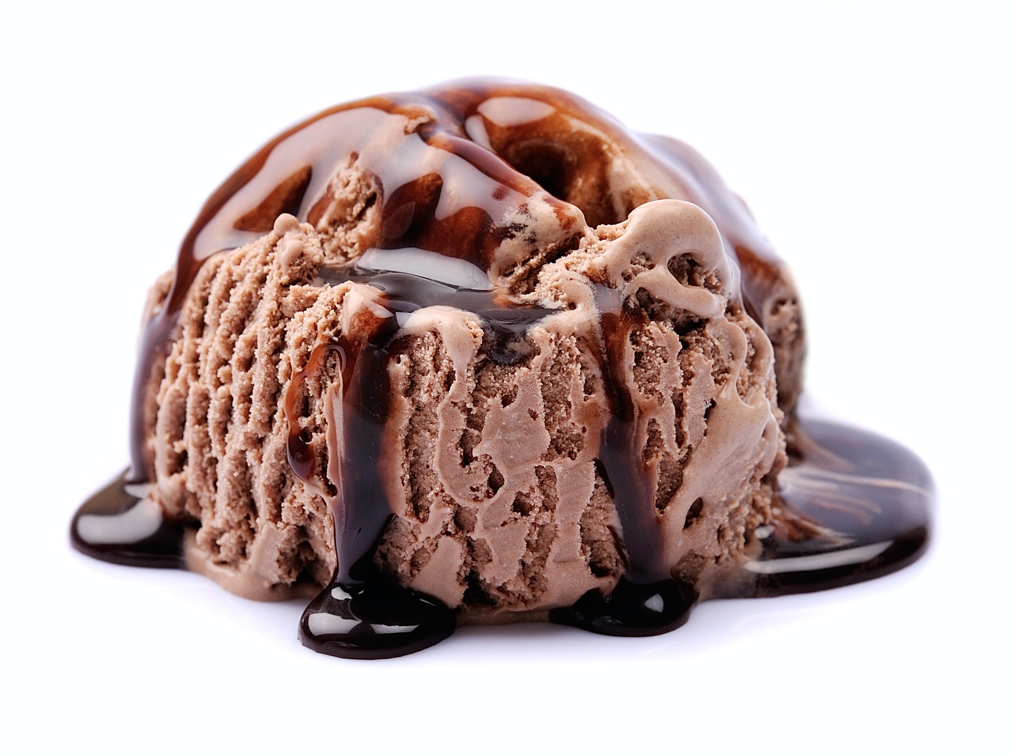 Chocolate ice cream with chocolate topping isolated on white.