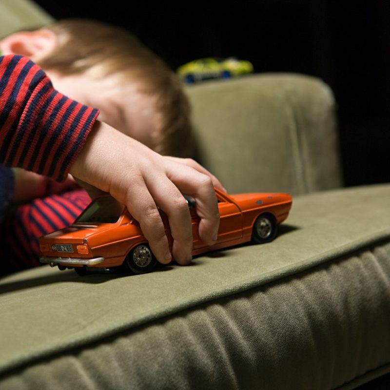 boy-playing-with-a-toy-car.jpg