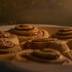 Fresh sweet homemade cinnamon rolls inside oven