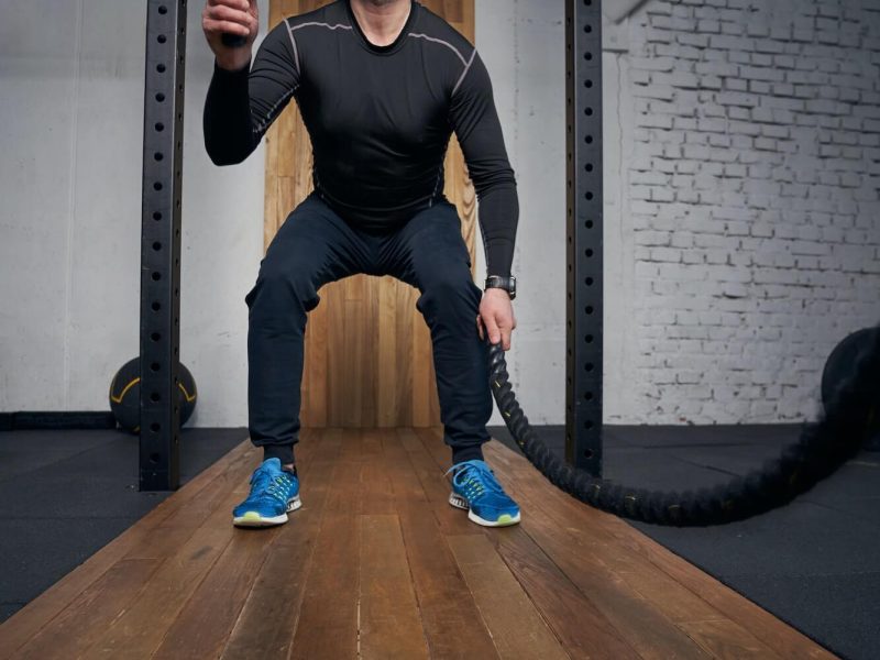 man-doing-exercise-with-fitness-rope-in-gym-1.jpg