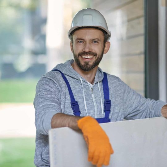 portrait-of-handsome-young-male-builder-in-hard-hat-looking-positive.jpg